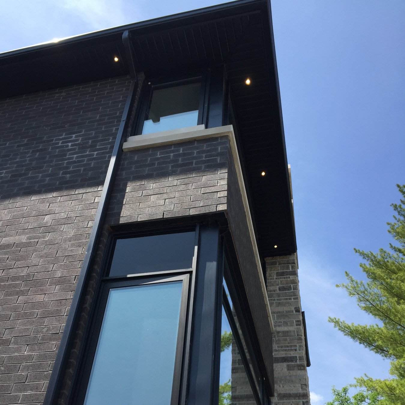 Modern dark cladding, soffit and fascia on a custom home