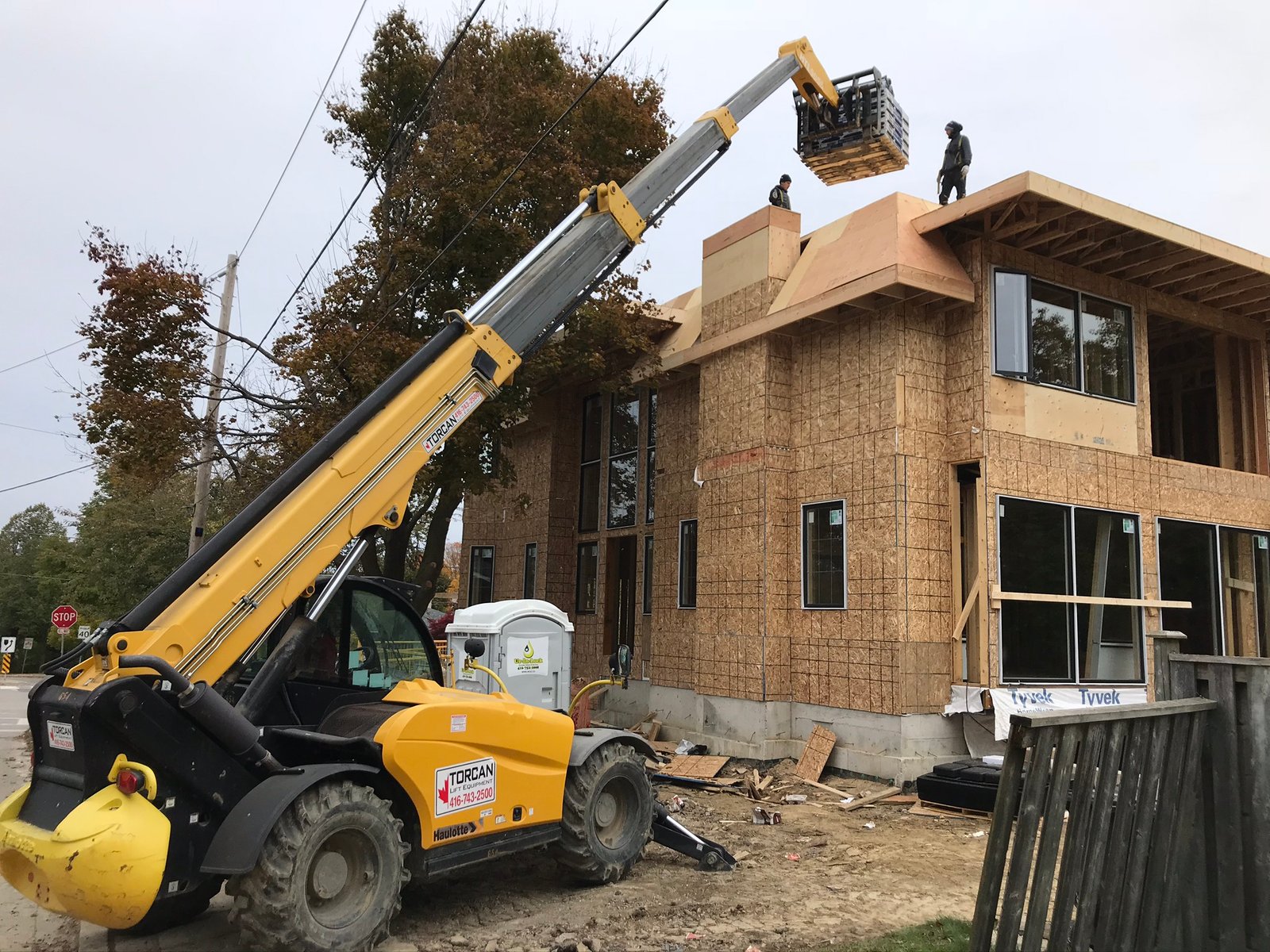 416 Roofing crew on a custom new-build with crane lift